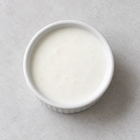 Buttermilk in a small white ramekin.