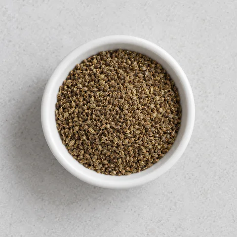 Celery seed in a small white ramekin.
