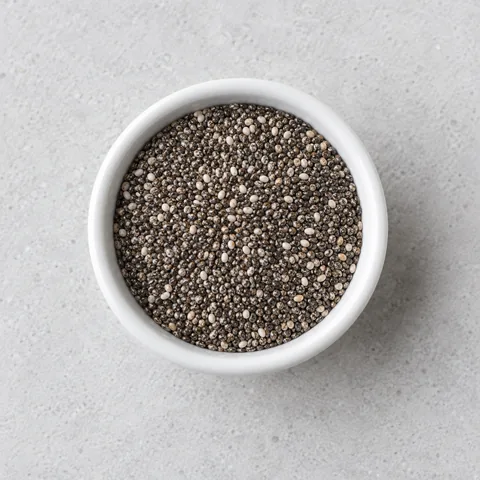 Chia seeds in a small white ramekin.