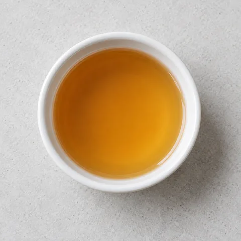 Apple cider vinegar in a small white ramekin.