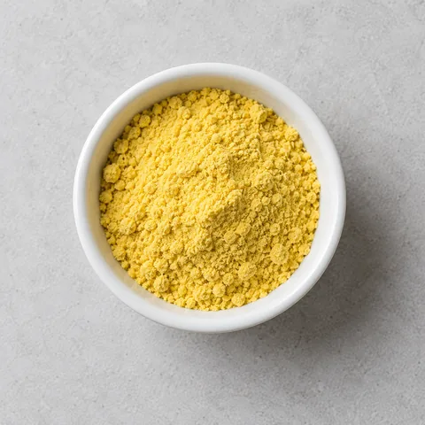 Dry mustard powder in a small white ramekin.