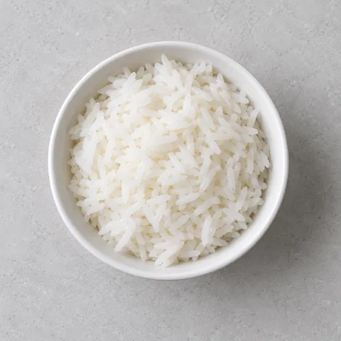 Steamed jasmine rice in a small white bowl.