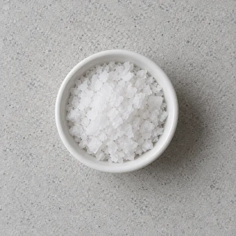 Kosher salt in a small white ramekin.