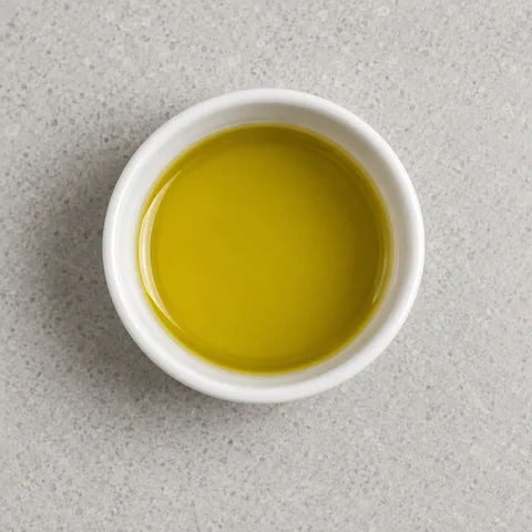 Olive oil in a small white bowl.