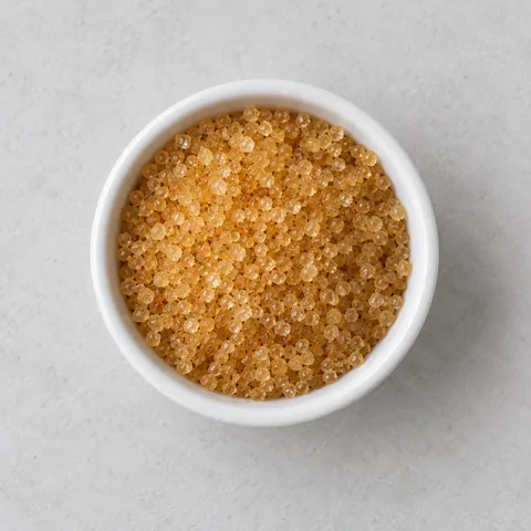 Turbinado sugar in a small white ramekin.
