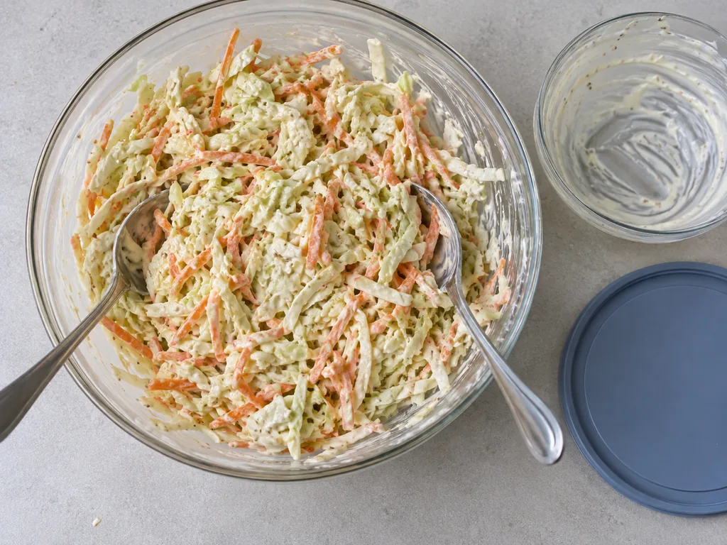 Toss until every shred is glossy, then cover and refrigerate until cold and the dressing has soaked in a little, about 30 minutes.