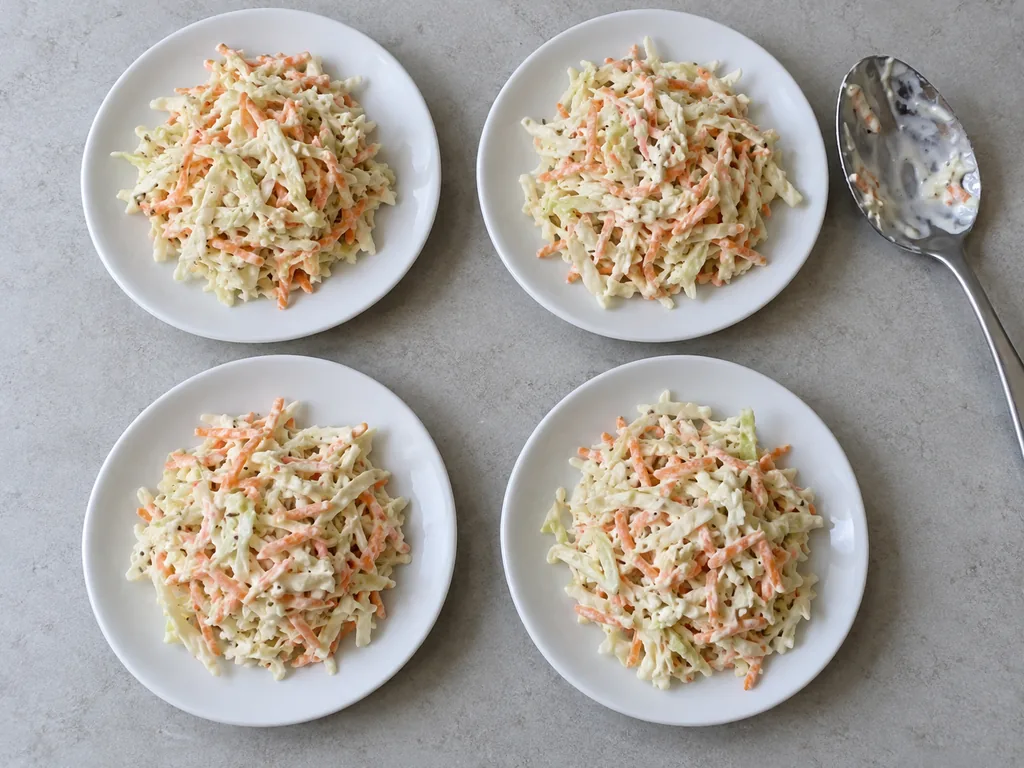 The coleslaw is served cold.